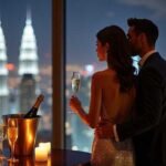 Couple enjoying champagne with city skyline view